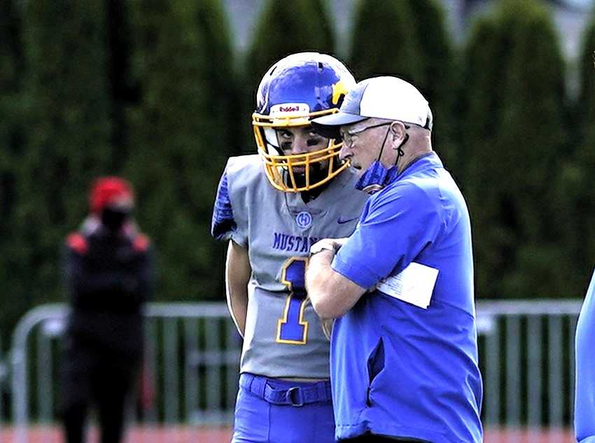 Greg Grant, with Landon Mitchell in 2021, has coached Heppner to five state championship games. (Photo by J.R. Olson)