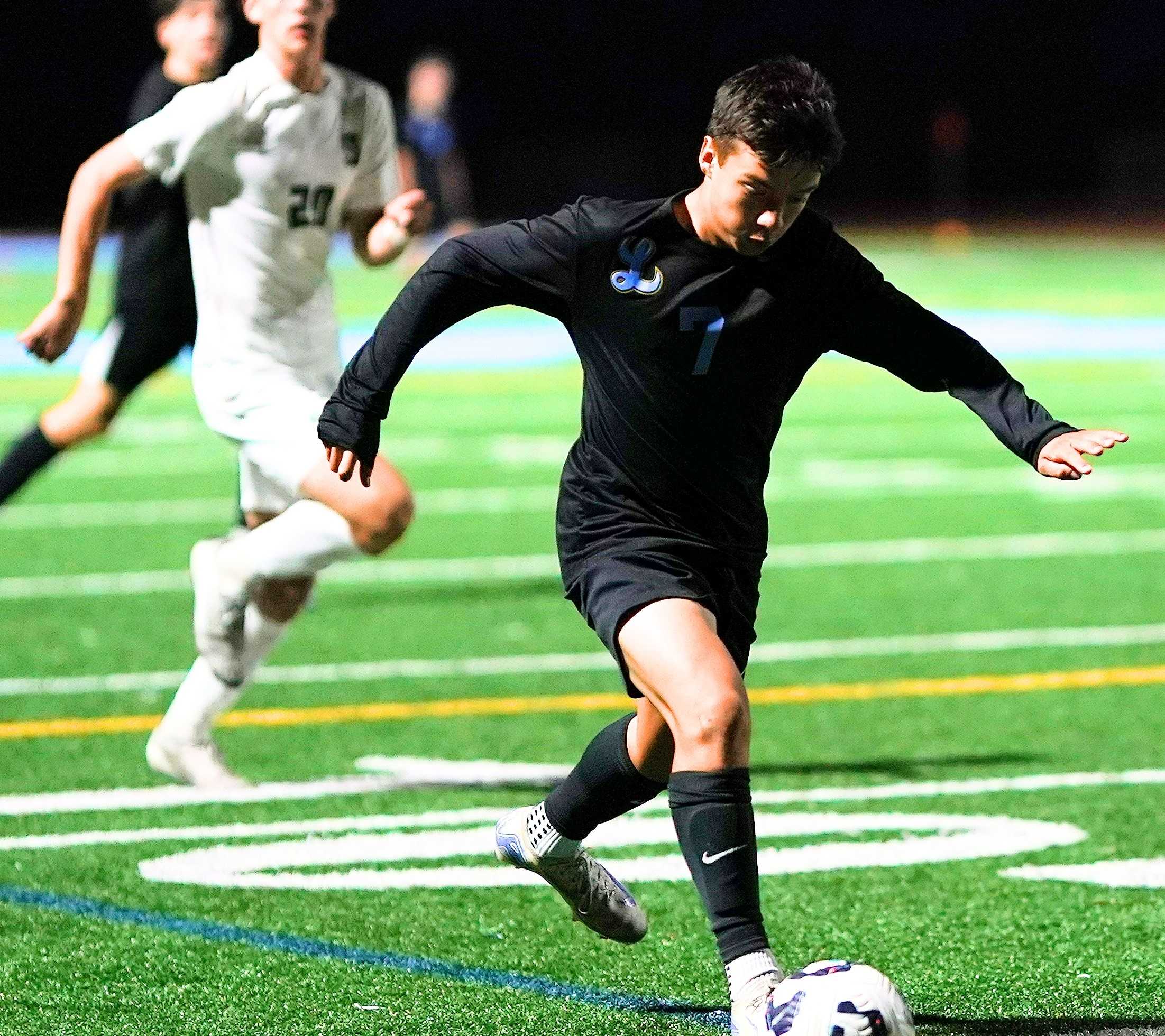 Lakeridge freshman Jackson Romero works the ball up the field in Tuesday's 2-1 win over Summit. (Photo by J.R. Olson)