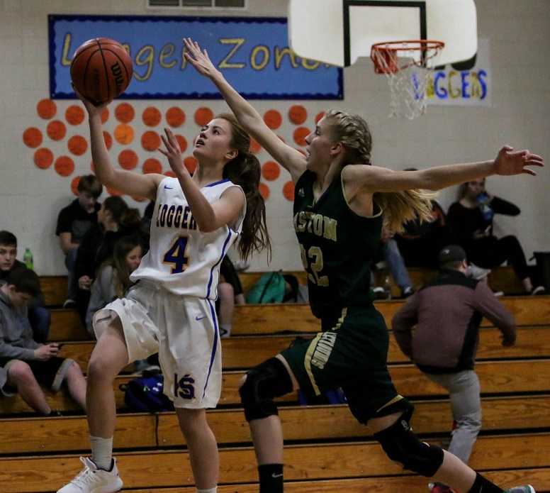 Knappa's Aiko Miller (4) drives against Gaston's Lily Johnson. (Photo by Krissy Goodman)