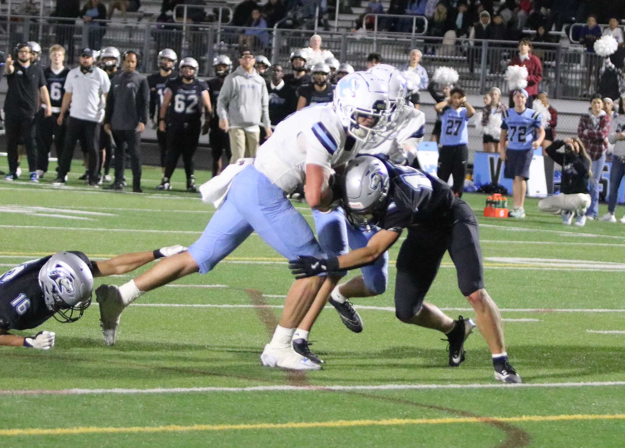 Lakeridge's Drew Weiler runs through Mountainside tacklers for the go-ahead TD with 29 seconds left Friday. (Jim Beseda photo)