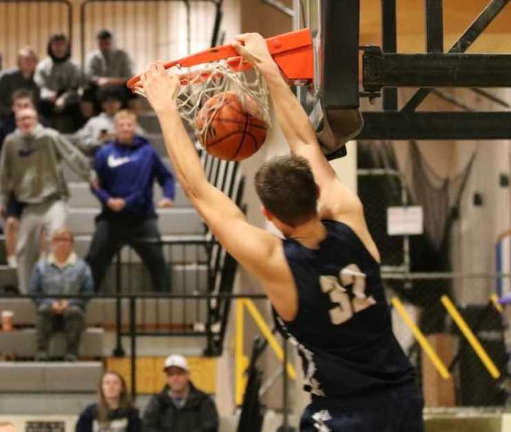 Blake Gobel's breakaway dunk helped propel Banks in overtime Friday at Gladstone. (Photo by Stewart Monroe)