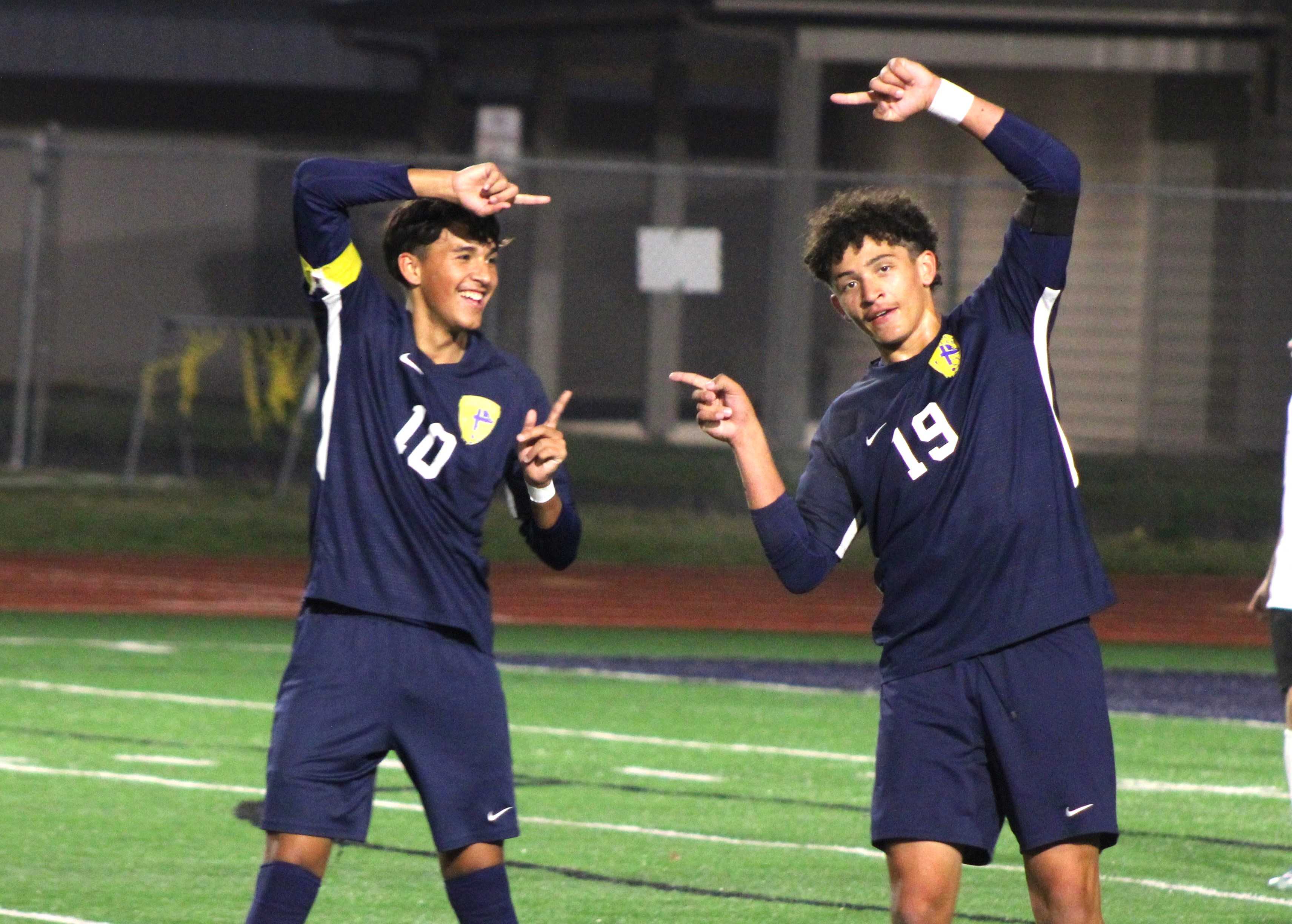 Stayton's Johnny Garcia (10) and Addison Samuell (19) celebrate a goal during Tuesday's win. (Photo by Jeremy McDonald)