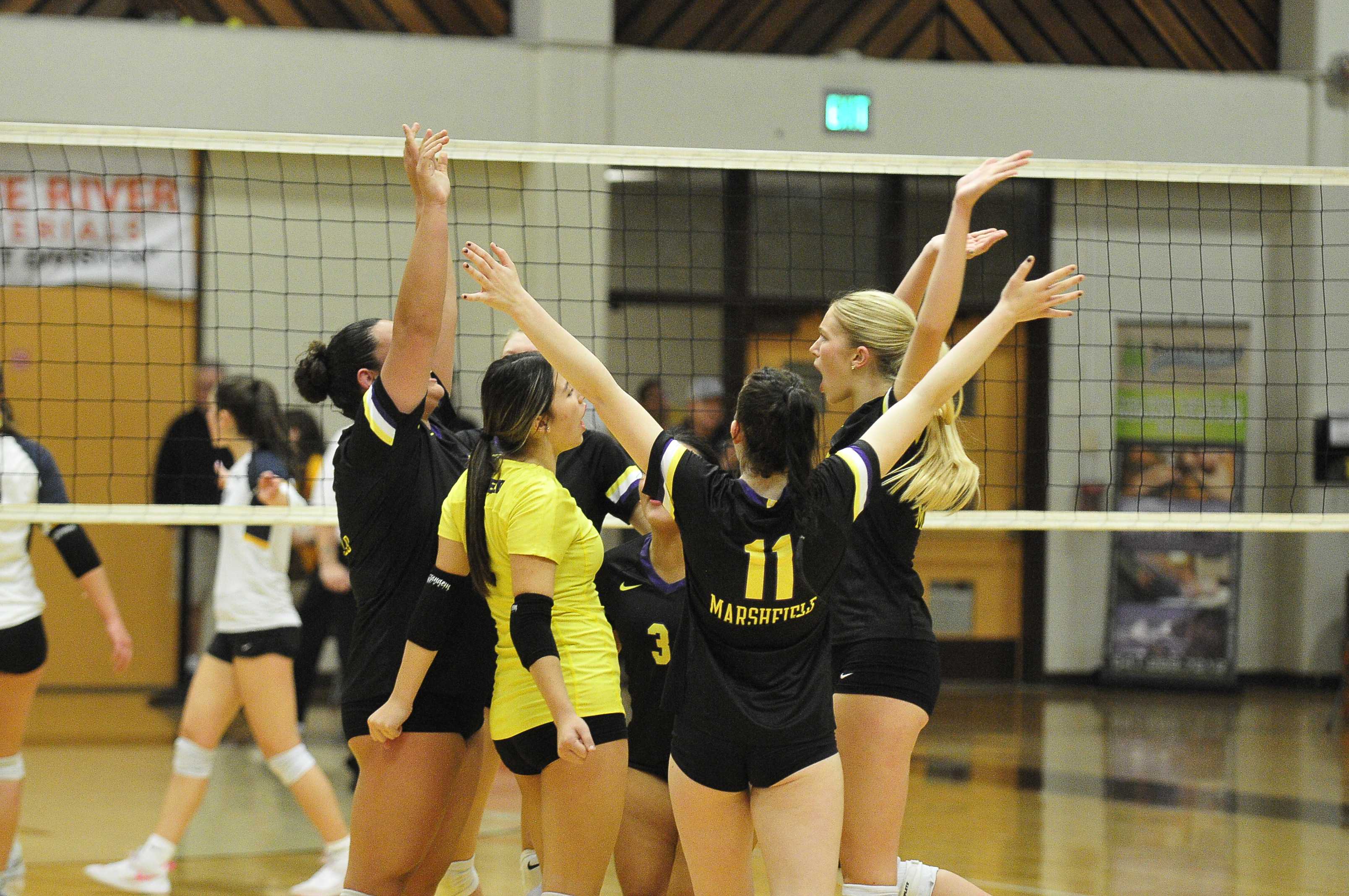 Marshfield celebrates its semifinal win over Stayton at North Bend High School on Friday. (Photo by John Gunther)