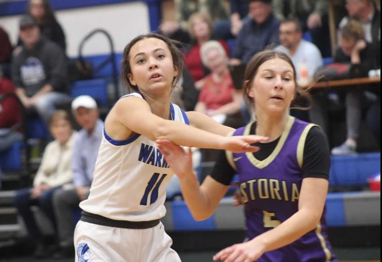 Amity's Mya Haarsma (11) guards Astoria's Brooklyn Avalon in a 66-57 nonleague home win Dec. 18. (Photo by Jeremy McDonald)