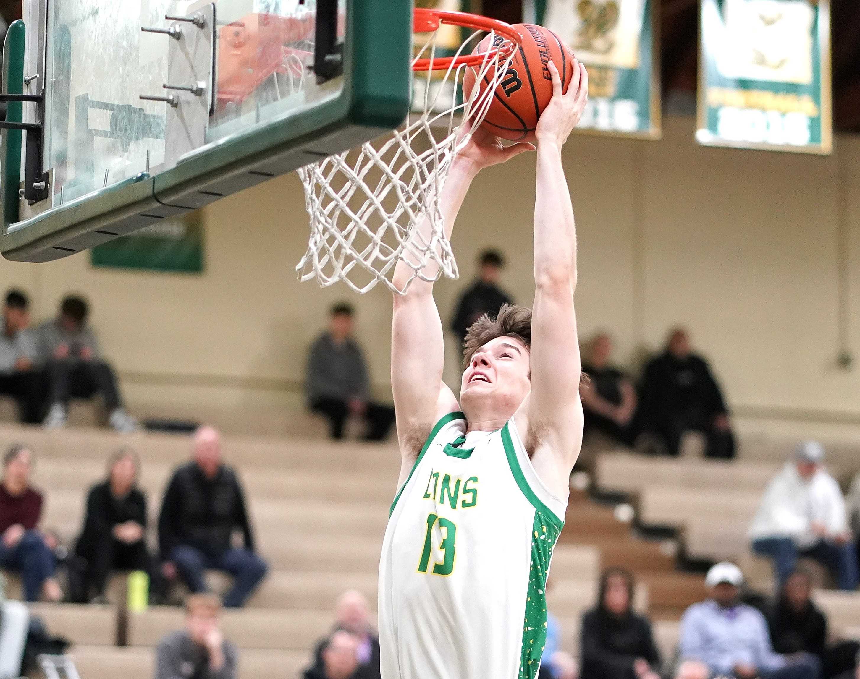 West Linn senior Gavin Gross goes up for one of his two dunks in Tuesday night's 71-30 win over Sunset. (Photo by J.R. Olson)