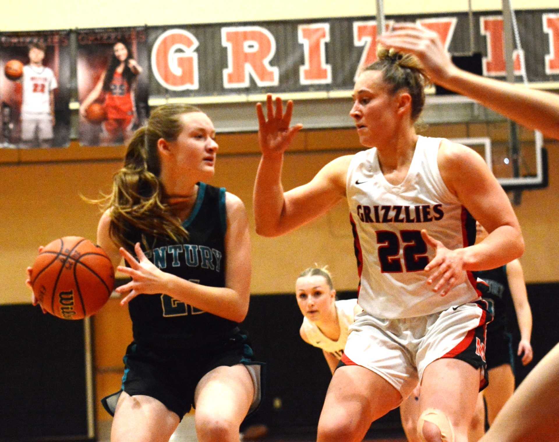 McMinnville's Macie Arzner (22) defends Century's Claire Keenan in a Pacific Conference game.(Wade Evanson/Hillsboro News-Times)