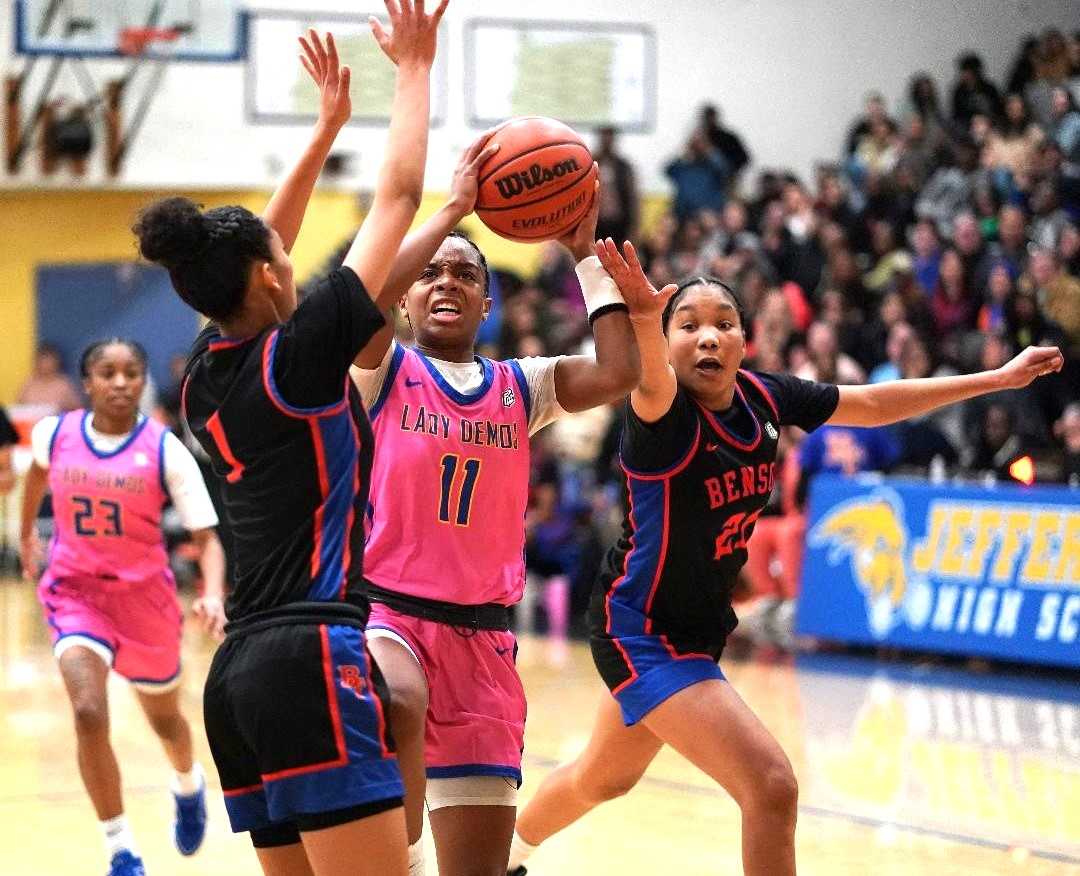 Jefferson's Abrianna Lawrence (11) drives against Benson's Kyoko Beasley (1) and Kelyn Johnson (21). (Photo by J.R. Olson)