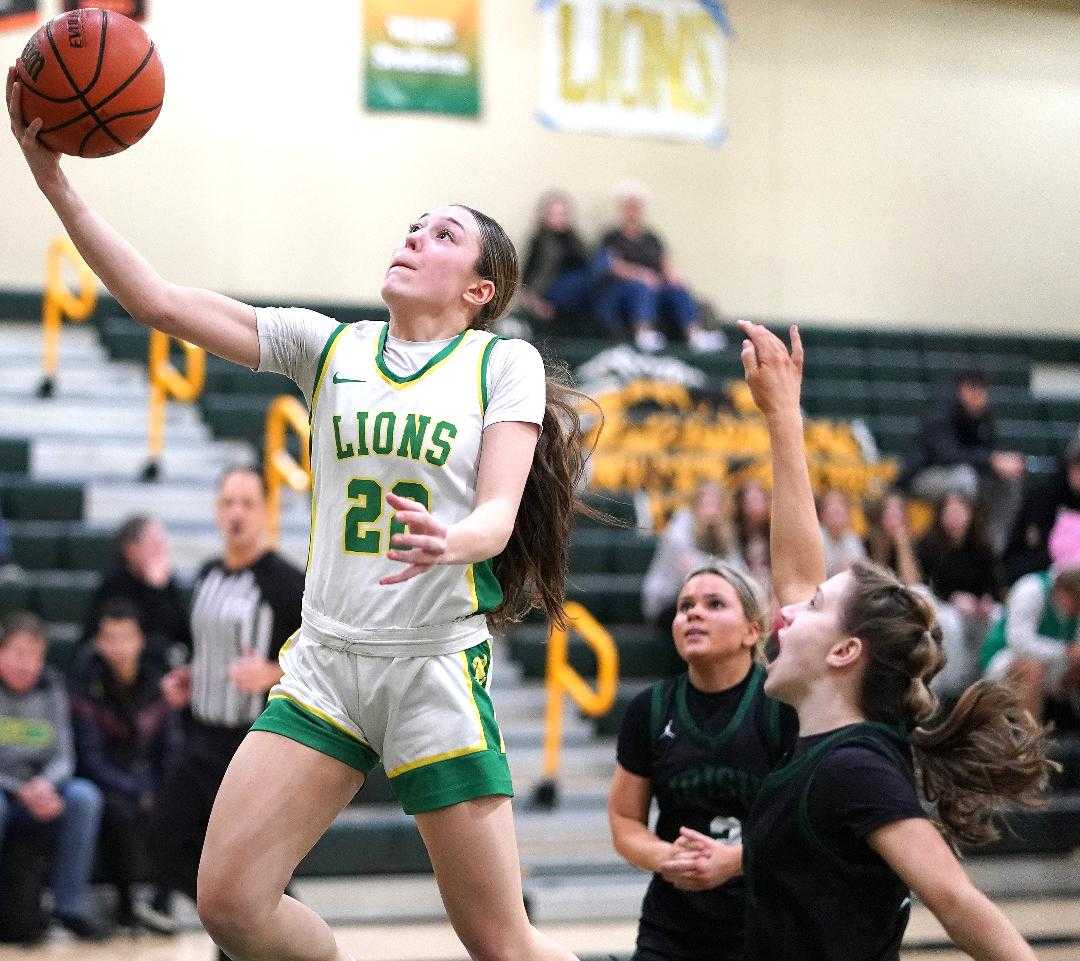 West Linn sophomore Kaylor Buse goes up for two of her 16 points in Tuesday's playoff win over Sheldon. (Photo by J.R. Olson)