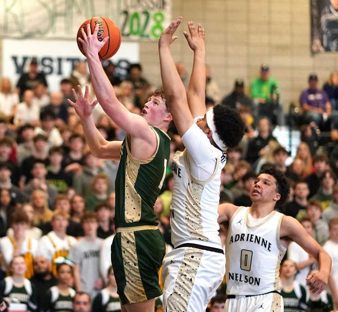 Jesuit's Pat Kilfoil drives to the basket in the Crusaders' 6A playoff win at Nelson on Saturday. (Photo by J.R. Olson)