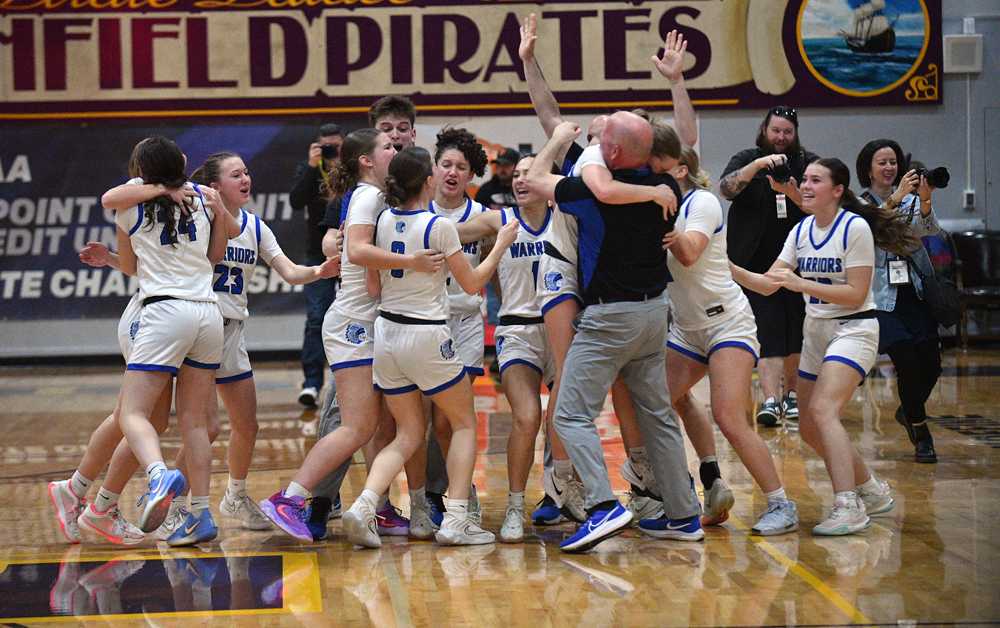 Amity celebrates its harrowing two-point win over Banks for the OSAA girls' 3A basketball title (John Gunther)