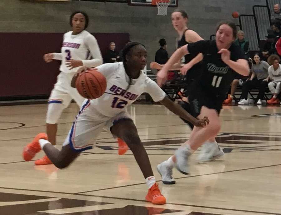 Benson's Aujae Yoakum drives against Tigard's Paige LaFountain (11).