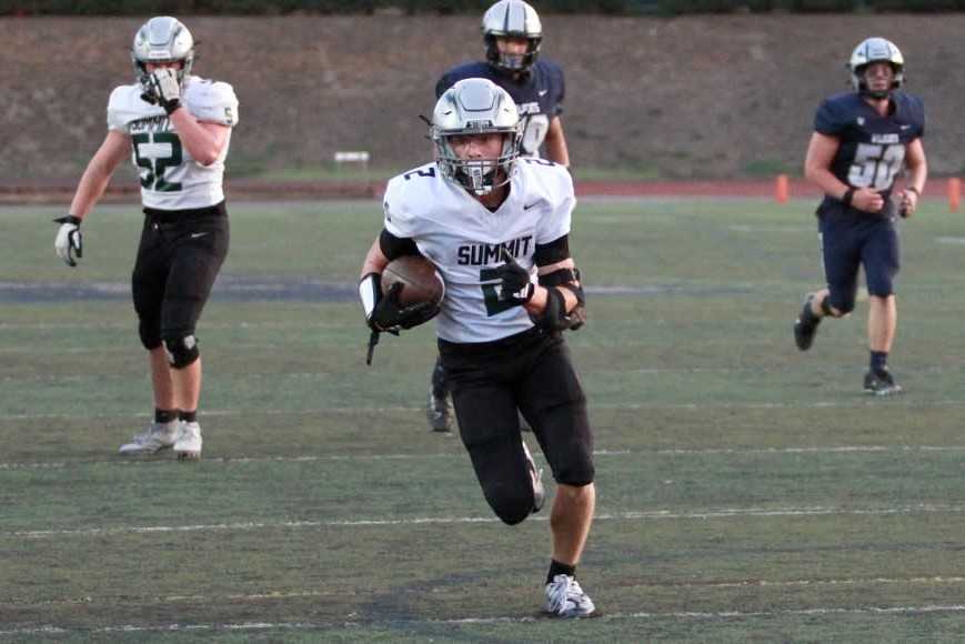 Summit's Connor Conneely had 11 catches for 171 yards and three touchdowns against Wilsonville. (Photo by Miles Vance)