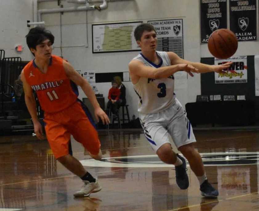 Western Christian's Jayce Roth (3) works around the defense of Umatilla's Sebastian Garcia (11). (Photo by Jeremy McDonald)