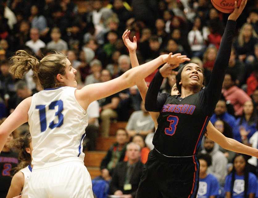 Benson's Ciera Ellington (3) drives past Grant's Schuyler Berry on Saturday night. (Photo by Norm Maves Jr.)