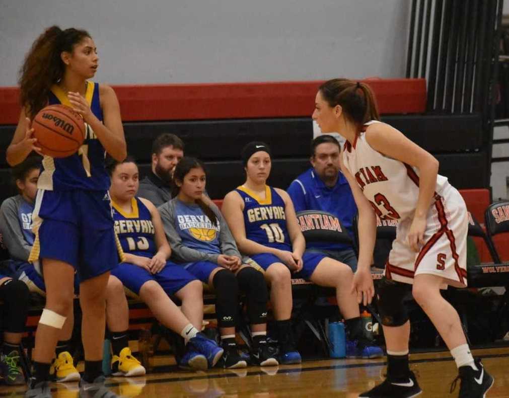 Gervais' Celi Vasquez (1) is guarded by Santiam's Shyanne Ward (23) on Monday night. (Photo by Jeremy McDonald)