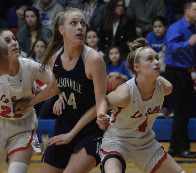 Wilsonville's Emilia Bishop (14) battles against La Salle Prep's Mia Skoro (left) and Lindsay Drango. (Photo by Derrick Drango)