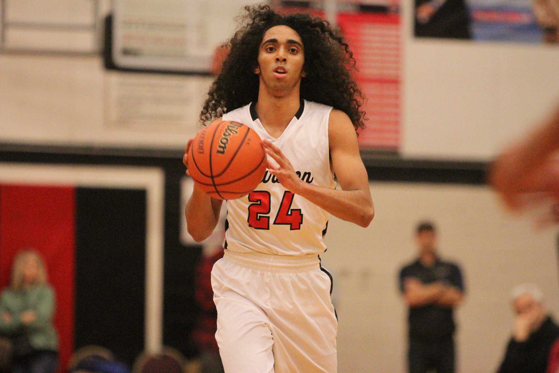 Isaac Lange is unique in several ways, including the flowing locks. Photo by Patrick Edmison