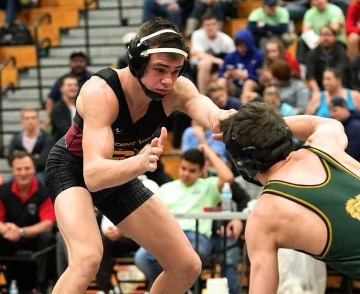 Crescent Valley's Legend Lamer (left) squares off with West Linn's Cael Brunson on Saturday. (Photo by Jon Olson0