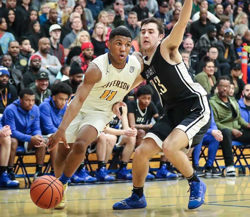 Jefferson's Trejon' Williams drives past Grant's Aidan Martin on Thursday night. (Serena Morones/OregonLive)