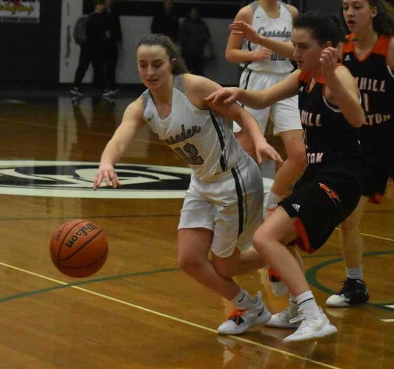 Salem Academy's Kirsten Koehnke (left) chases a loose ball against Yamhill-Carlton's Olivia Southard. (Photo by Jeremy McDonald)