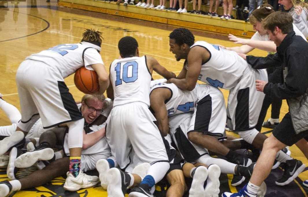 De La Salle North Catholic players celebrate after winning last year's state final. (Ed Glazar/The World)