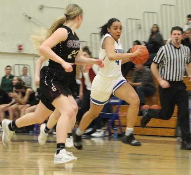 Grant's Monka Hickok pushes up the court against Glencoe's Breauna Van Dyke (24). (Photo by Chloe Barker)