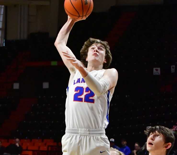 Churchill's Kaelin O'Neil goes to the basket against La Salle Prep's Nolan Grogan. (Photo by Joe Richter)