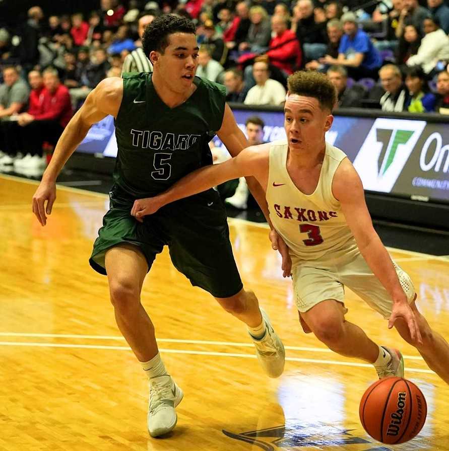 South Salem's Trey Galbraith (3) drives past Tigard's Drew Carter. (Photo by Jon Olson)