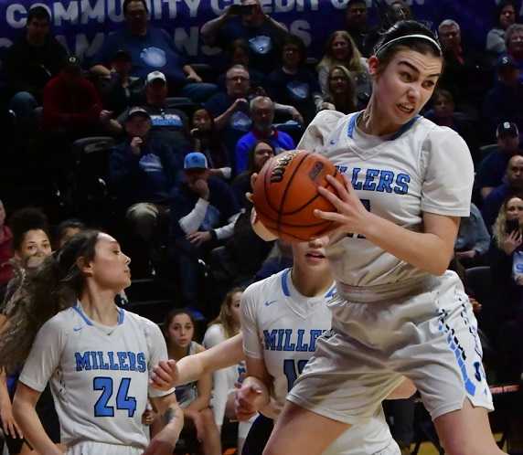 Springfield's Reice Newell grabs a rebound in her team's win over Churchill on Thursday. (Photo by Joe Richter)