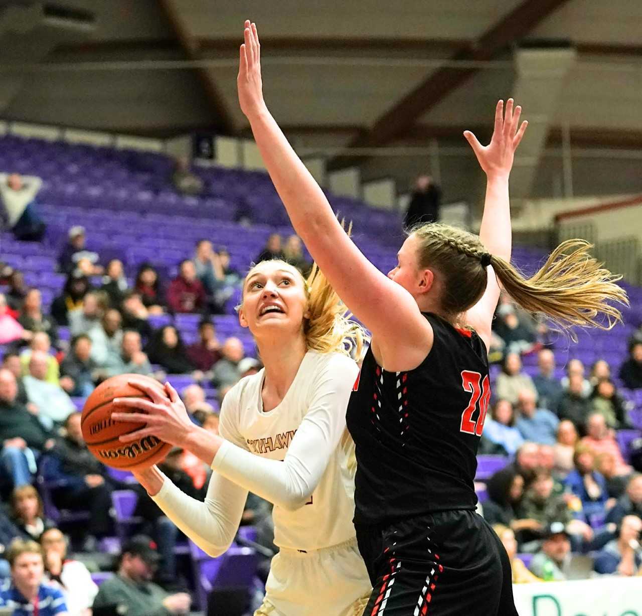 Southridge's Cameron Brink turns to shoot against Beaverton's Laura Erikstrup. (Photo by Jon Olson)