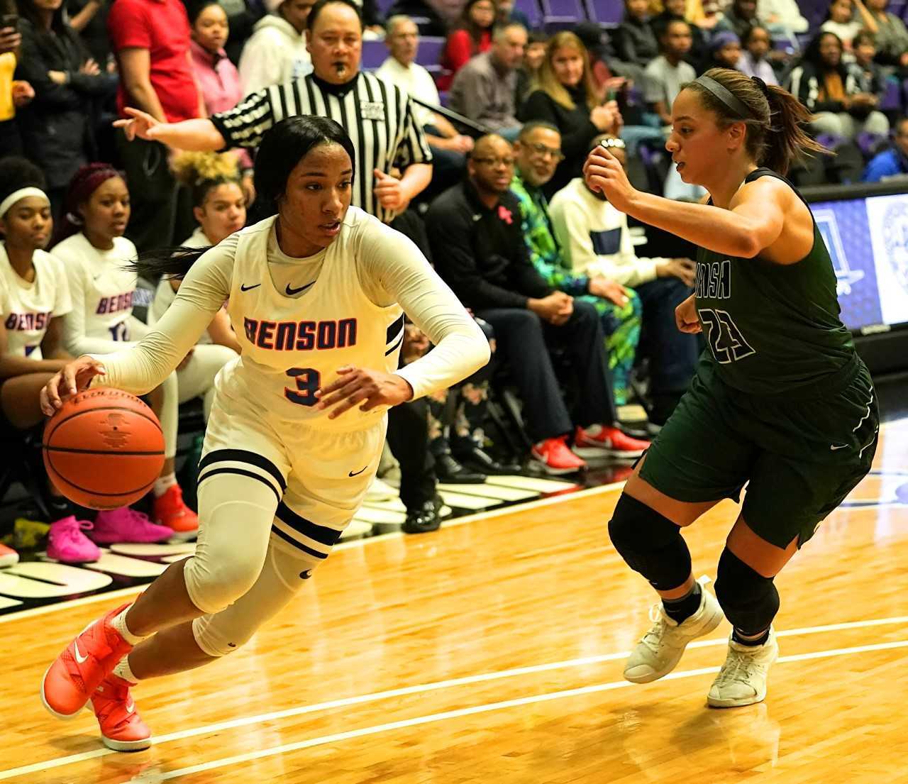 Benson's Ciera Ellington drives to the basket against Sheldon's Makayla Scurlock. (Photo by Jon Olson)