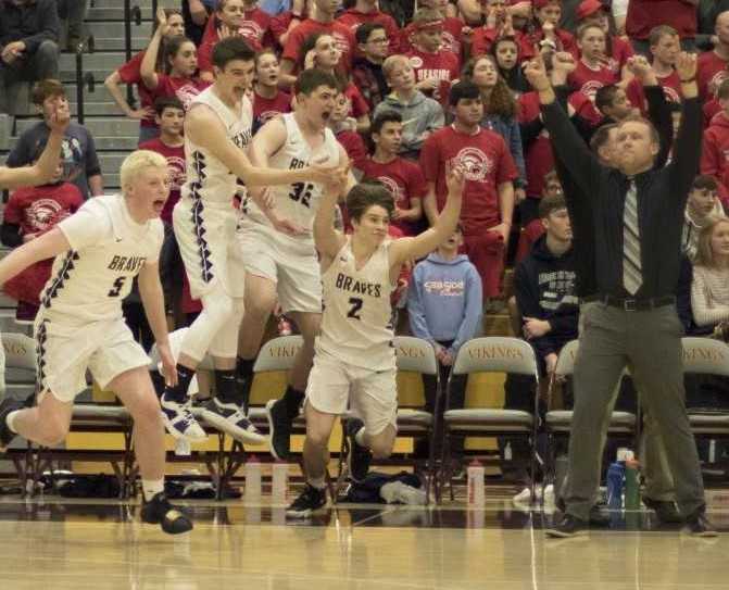 Banks players celebrate in the final seconds of their championship win over Seaside on Saturday. (Photo by Peter Christopher)