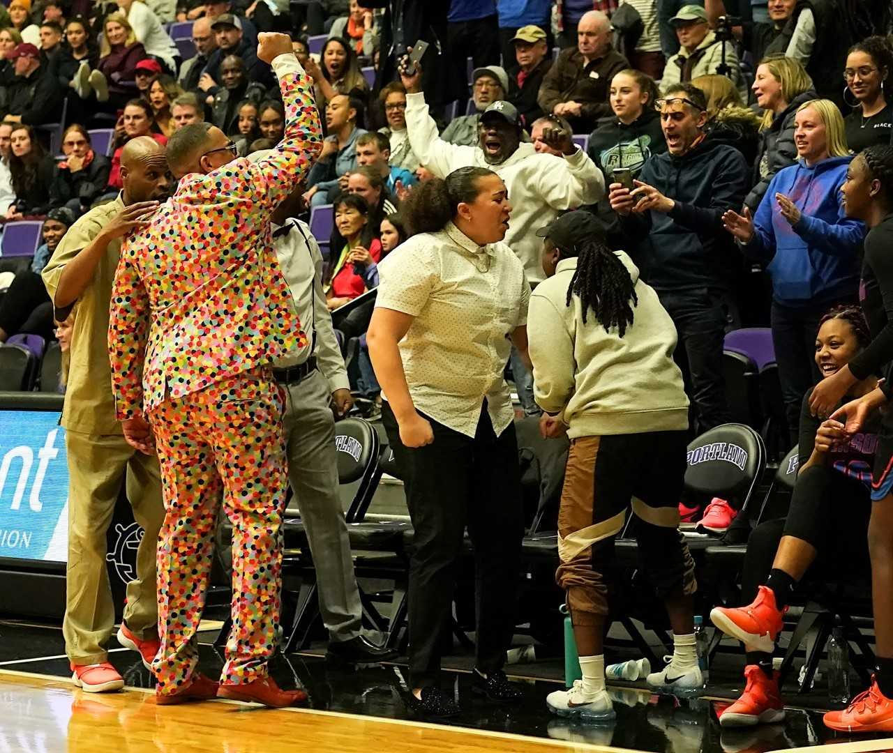 Coach Eric Knox cheers with Benson supporters during Saturday's 6A championship game. (Photo by Jon Olson)