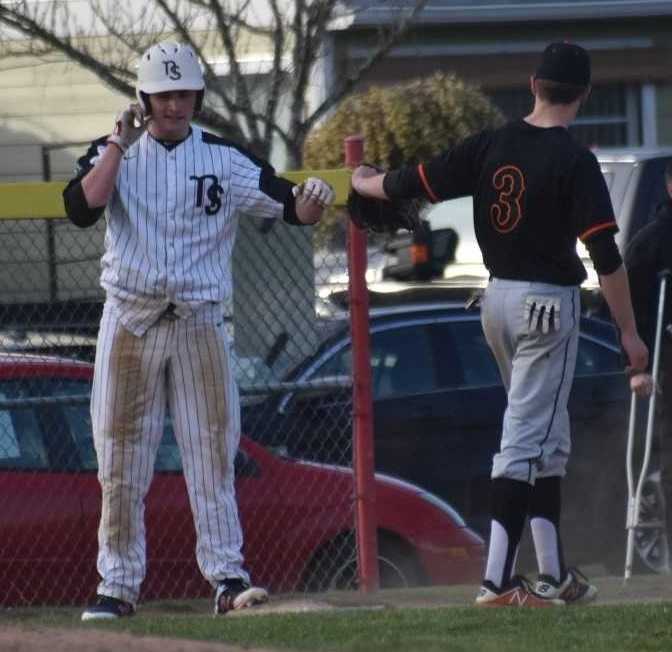 North Salem's Zach Goodwin (left) fist-bumps with Silverton's Caleb Ward. (Photo by Jeremy McDonald)