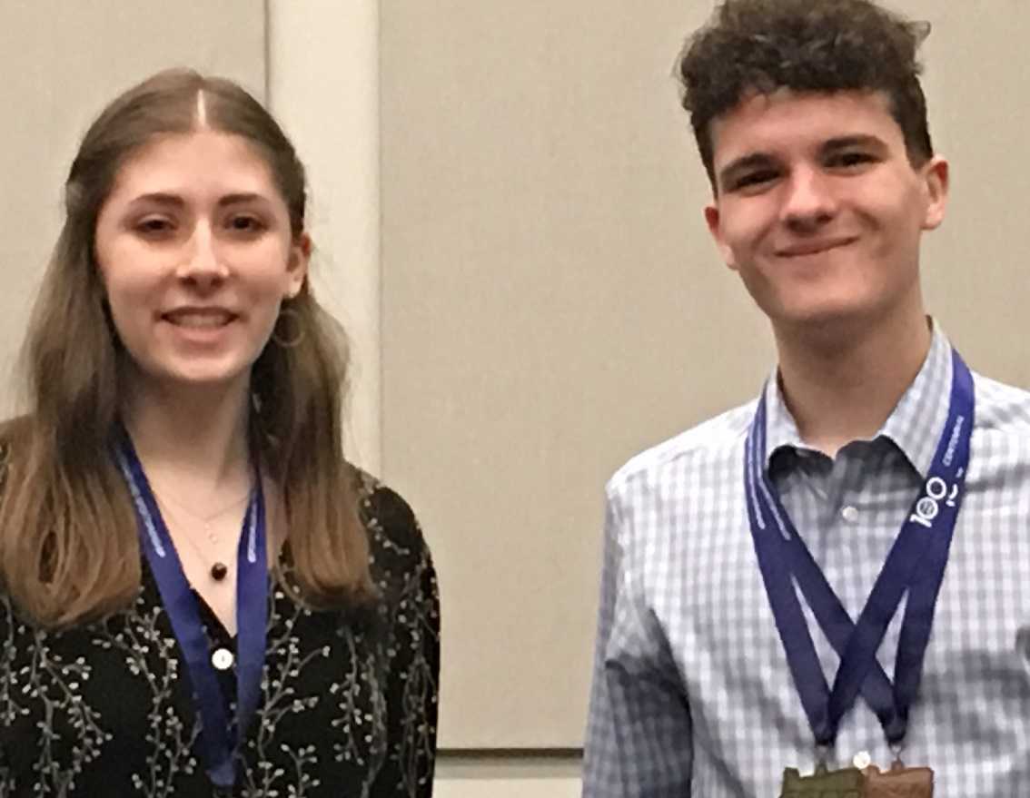 Grant's Zoe Beyler (left) and West Salem's Logan Krause pose with their medals.