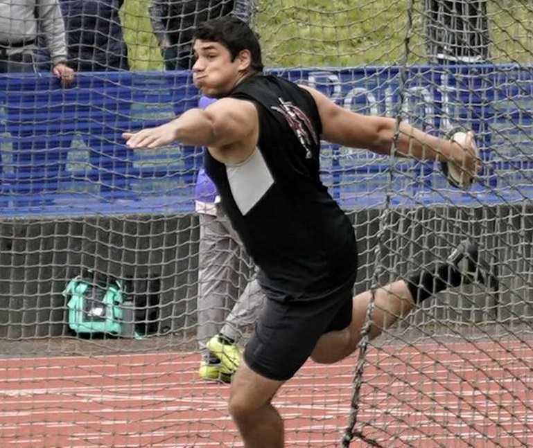 Mariano Kis won the shot and discus for Tualatin. (Photo by Jon Olson)