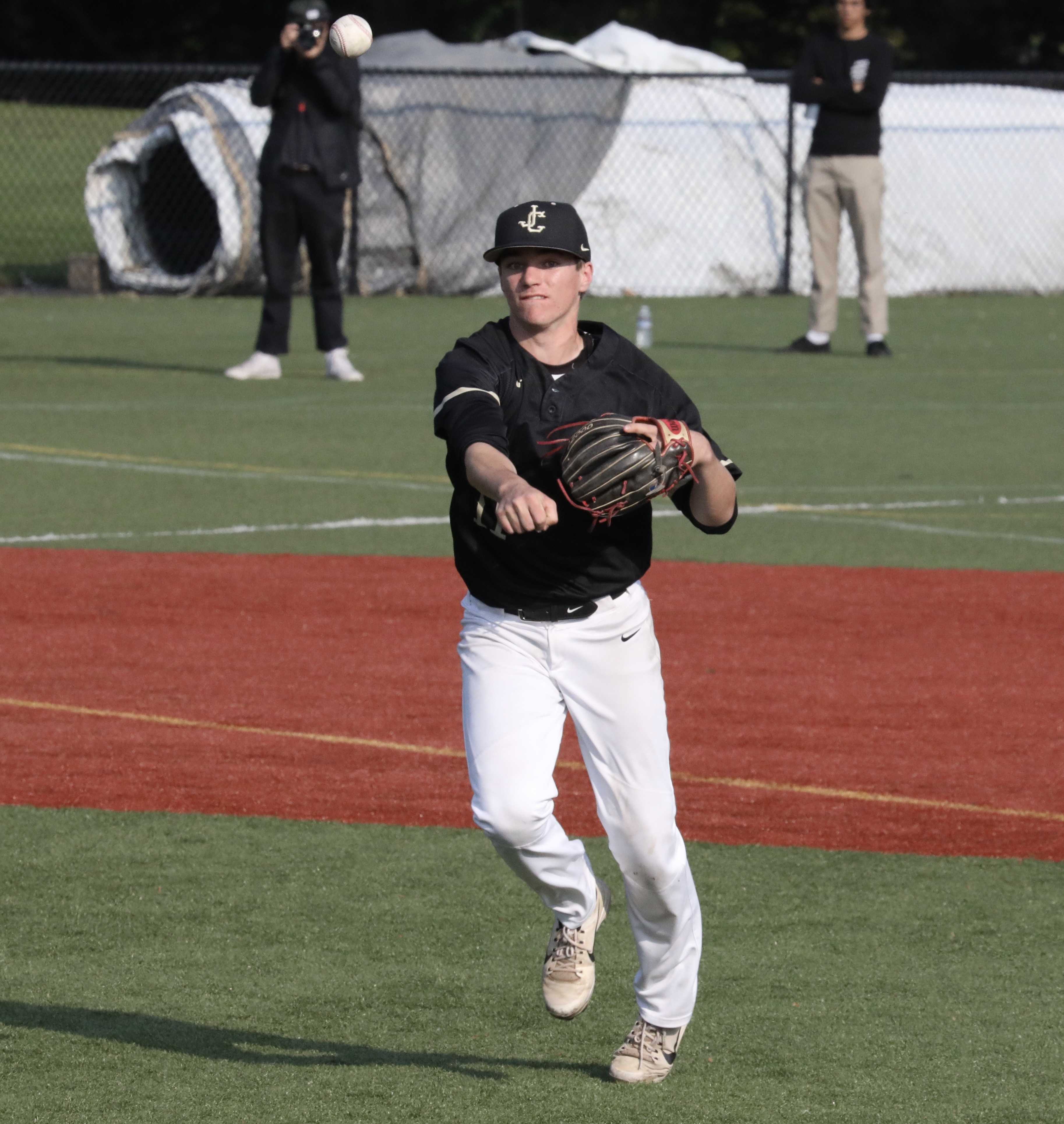 Jesuit third baseman Kevin Blair fires to first to retire South Salem's Ryan Brown on a fourth-inning ground ball.