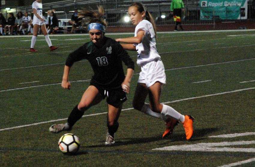 West Linn senior Rae Peters (18) scored three times in her debut at forward for the Lions on Tuesday