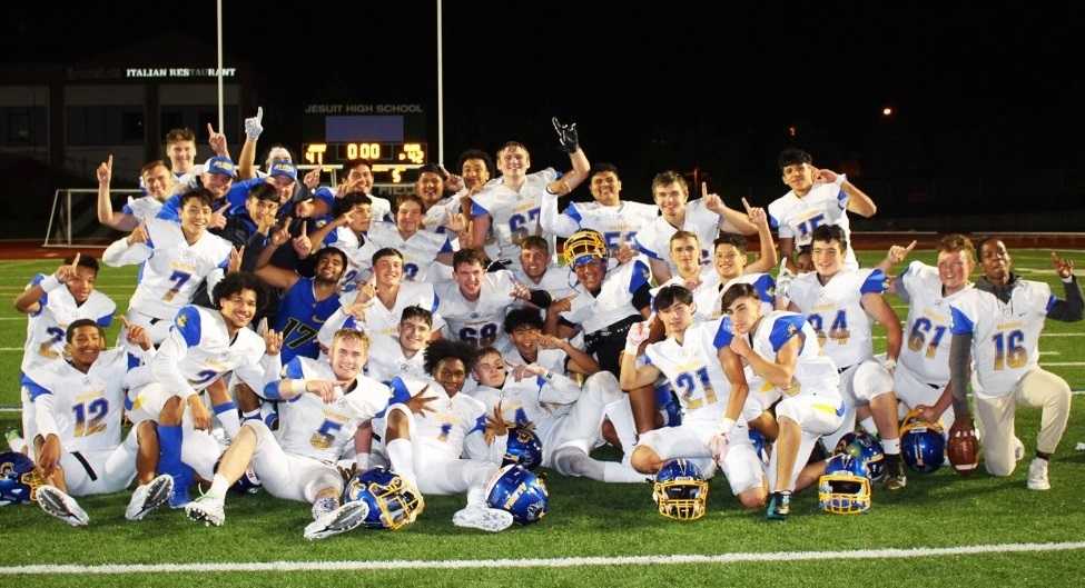 Aloha players bask in their 42-41 win at Jesuit on Friday night. (Photo by Hanna Plasker)