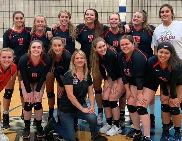 Creswell's volleyball team poses with coach Anna Baltrusch after her 500th win. (Photo courtesy Creswell High School)