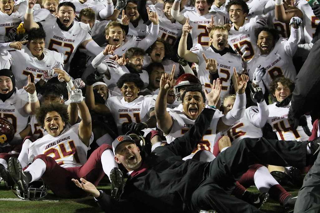 Coach Steve Pyne and the Central Catholic Rams celebrate Friday's win at Clackamas. (Photo by Jim Nagae)