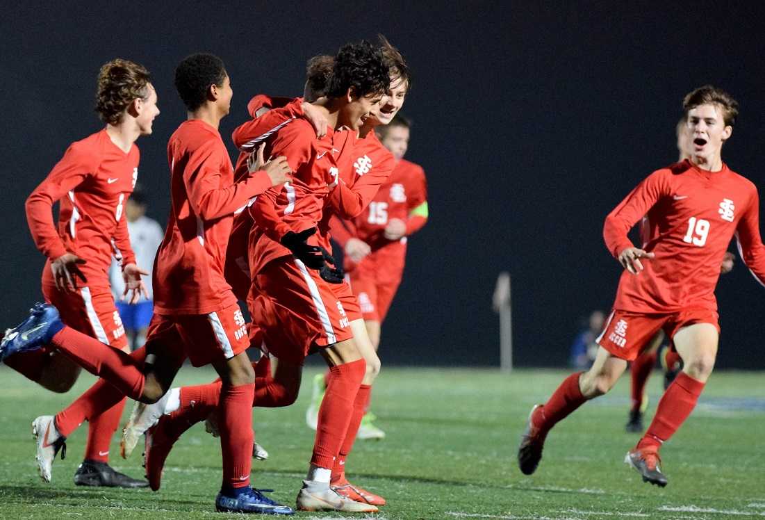 La Salle Prep players celebrate with Manny Arredondo after his second-half goal Tuesday. (Photo by Lauren Craven)