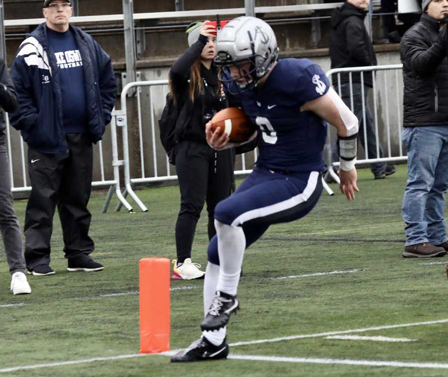 Lake Oswego's Casey Filkins crosses the goalline, both in the final and on his career as a Laker. Photo by Norm Maves