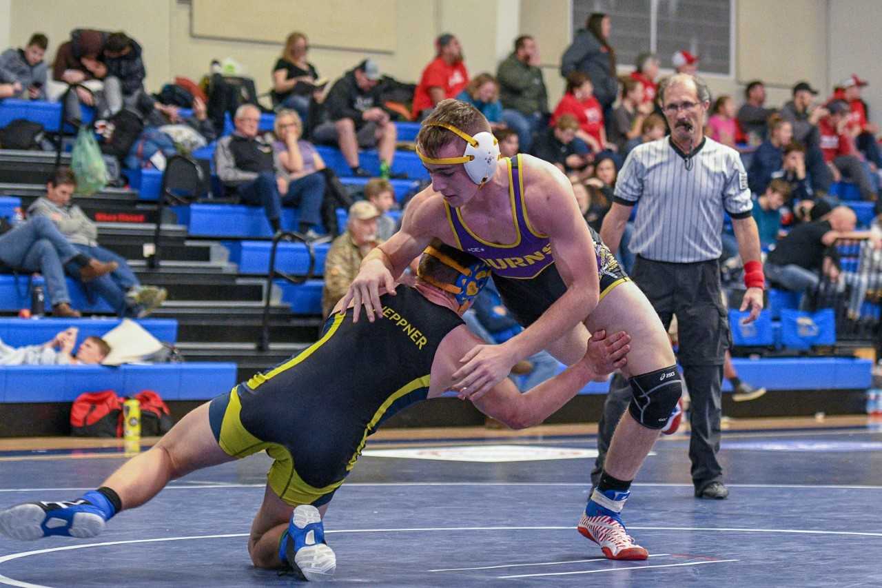 Senior Anthony Moulton (right)  is one of six state placers back for Burns. (Kirsti Cason/Eastern Oregon Sports Photos)