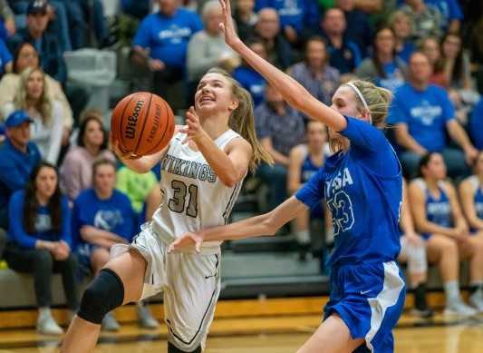 Vale's Ashley Jacobs drives against Nyssa's Gracie Johnson on Saturday. (Randy Seals/Eastern Oregon Sports Photos)