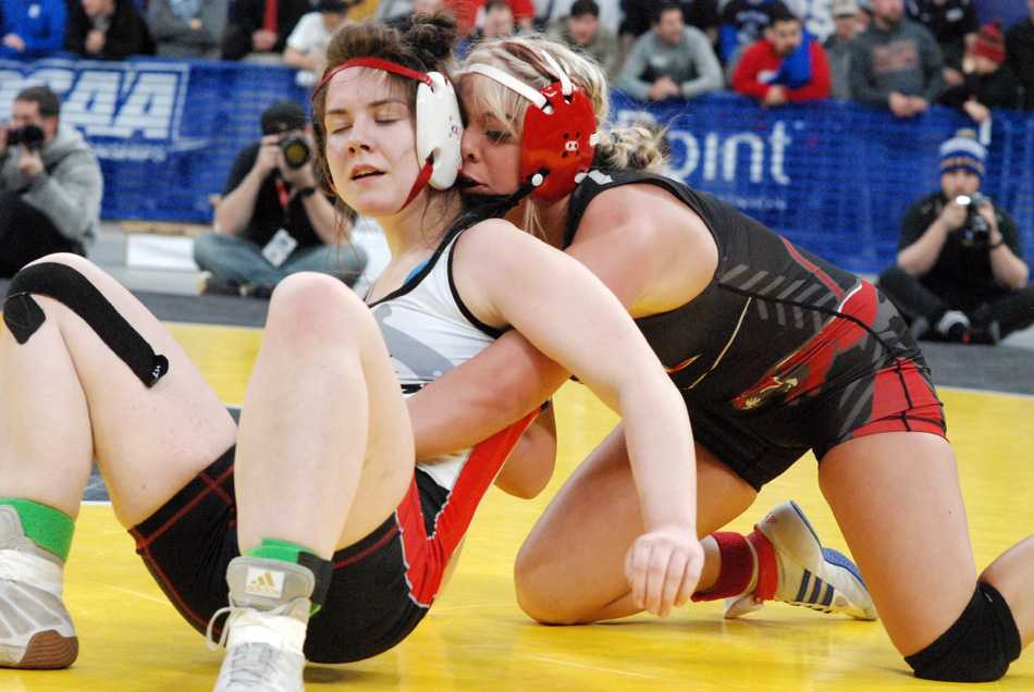 Taylor Ohlson (right) controls Thurston's Lindsay Burrell. Ohlson won the 135 title but Thurston took the team title