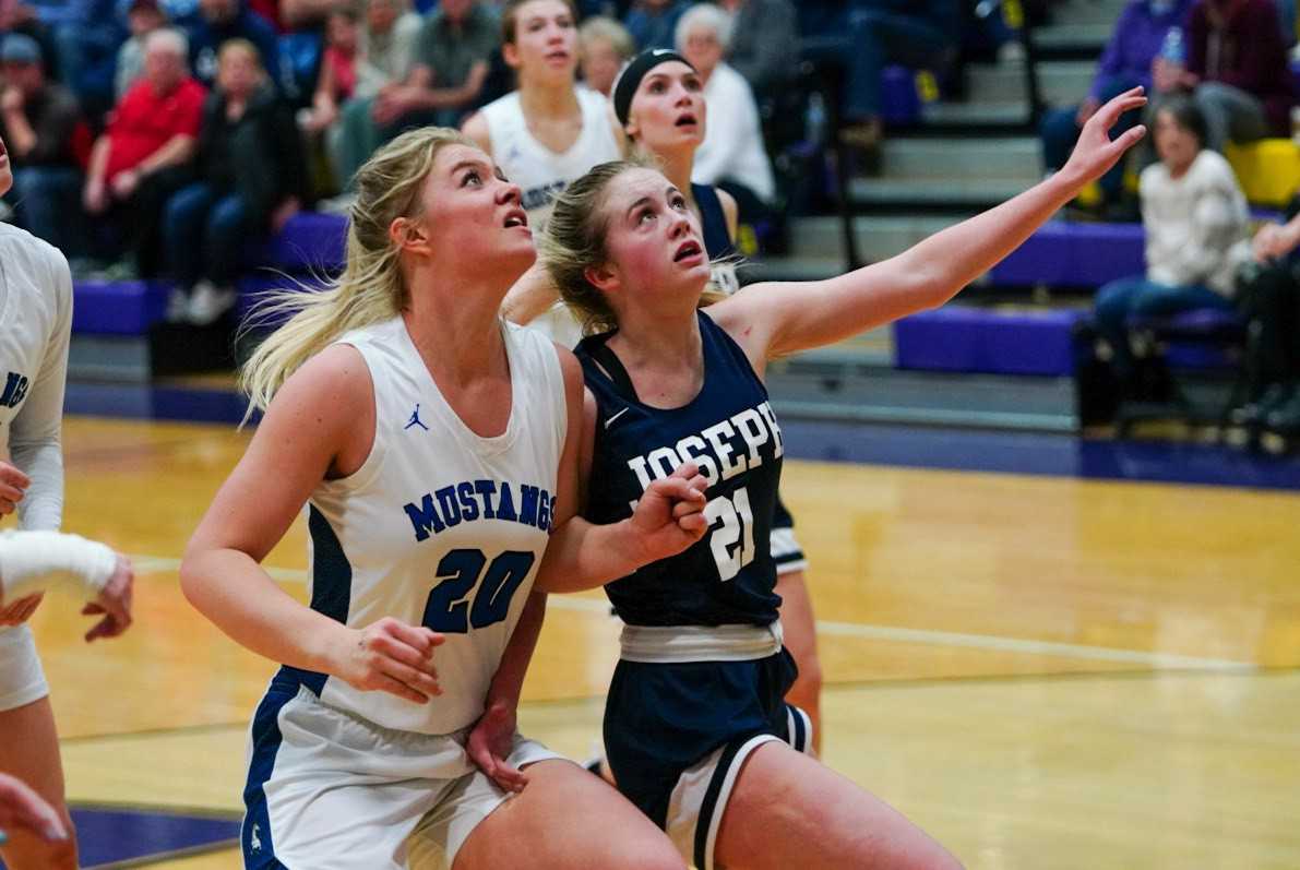 Crane's Riley Davis (20) battles for position with Joseph's Sabrina Albee. (Randy Seals/Eastern Oregon Sports Photos)