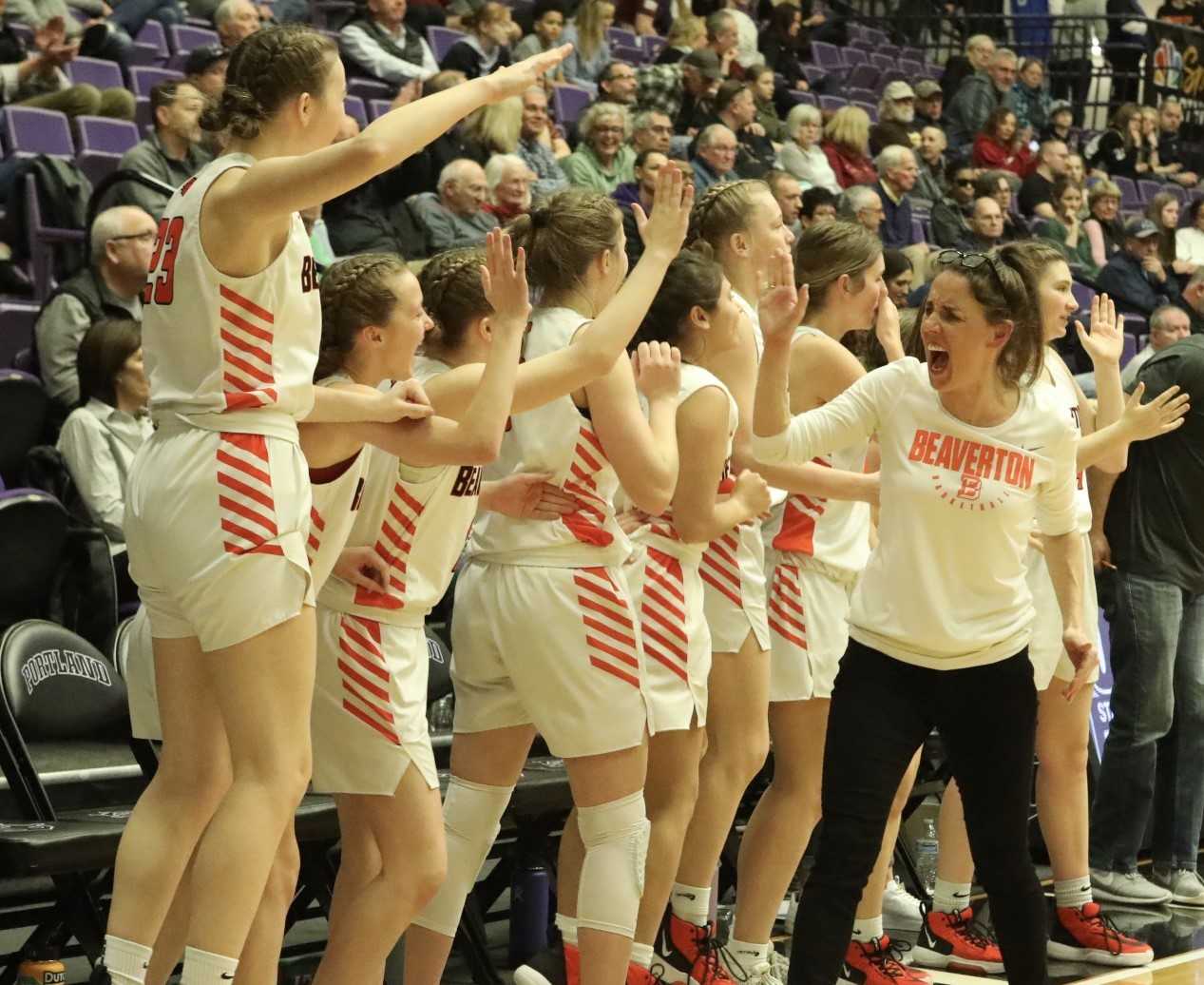 Beaverton coach Kathy Naro celebrates Wednesday's win over Southridge with her players. (Photo by Norm Maves Jr.)