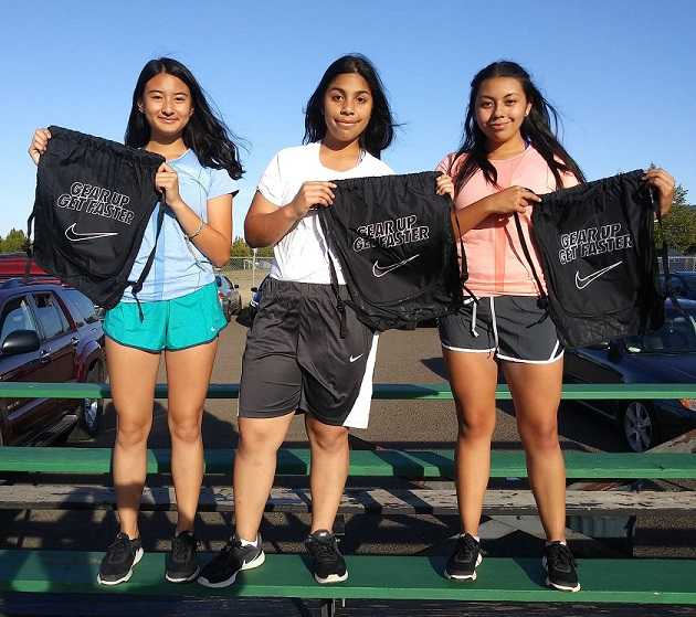 Parkrose runners (left to right) Michelle Nuyen, Rachel Vergara and Vivian Varela received Nike gear from the OSAA Foundation.