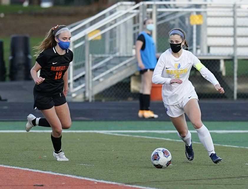 Barlow's Mikayla Topaum (right), working against Beaverton's Katelyn Sanders, scored twice Monday. (Photo by Jon Olson)